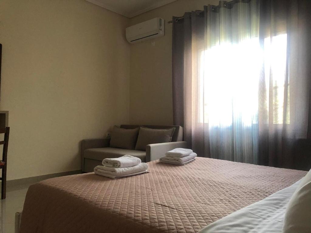 Letto o letti in una camera di Milos Apartments