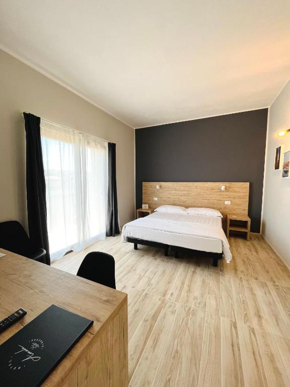 Posteľ alebo postele v izbe v ubytovaní Amada Hotel Siracusa