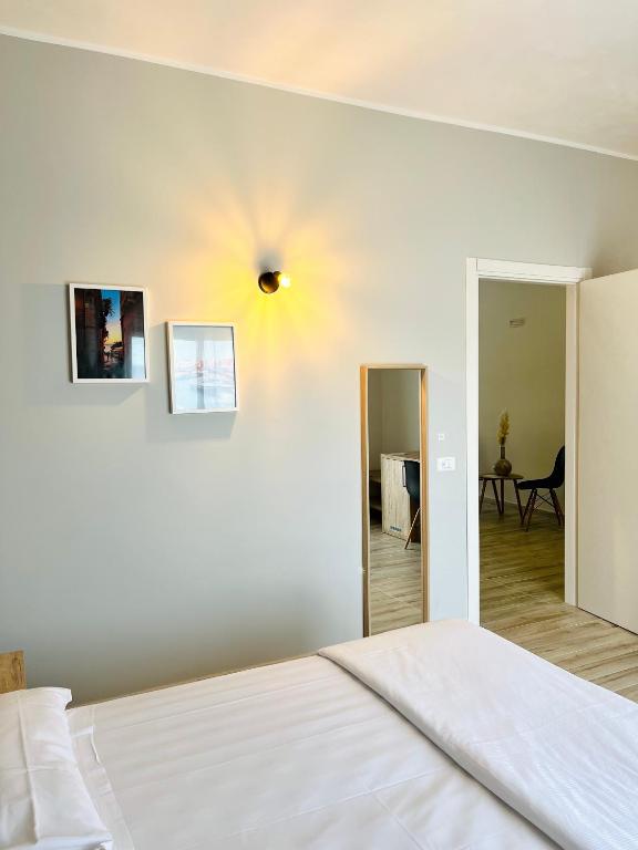 Posteľ alebo postele v izbe v ubytovaní Amada Hotel Siracusa
