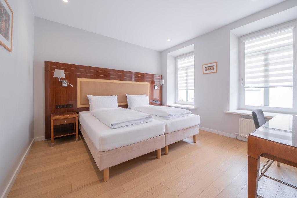 Postel nebo postele na pokoji v ubytování Lollo Residence - Lollo Luxury