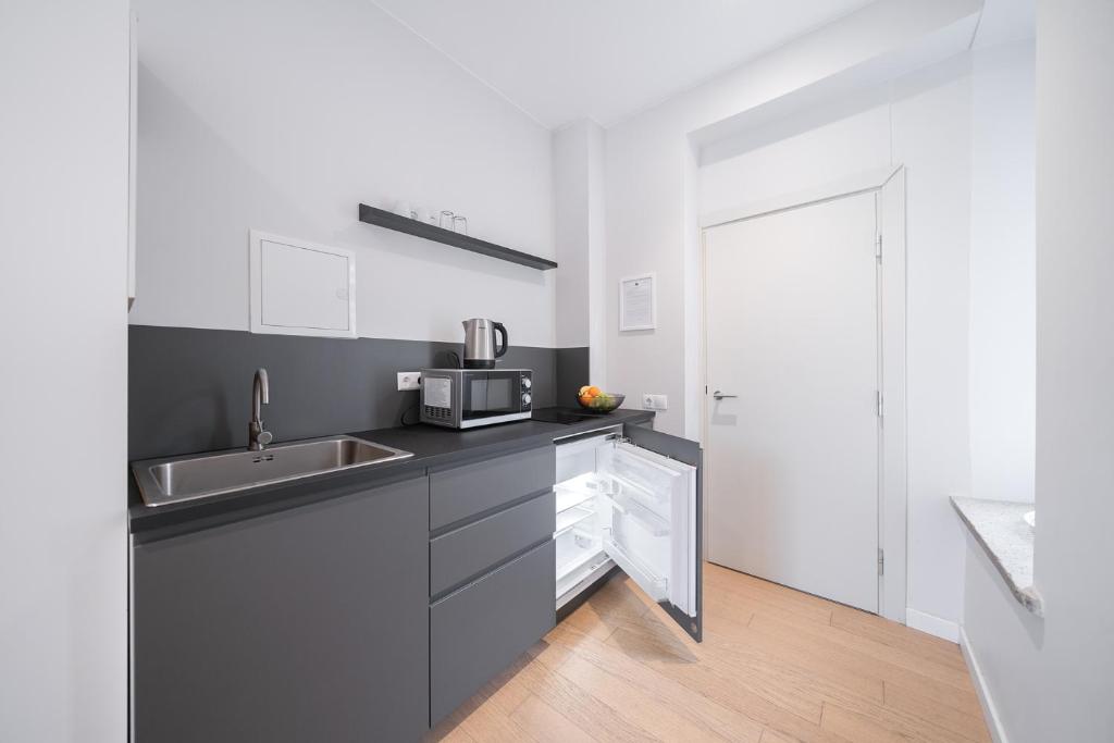 Kuchyň nebo kuchyňský kout v ubytování Lollo Residence - Lollo Luxury