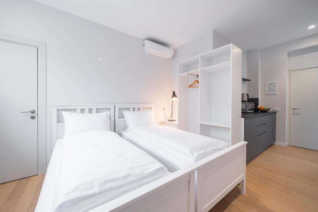 Postel nebo postele na pokoji v ubytování Lollo Residence - Lollo Luxury