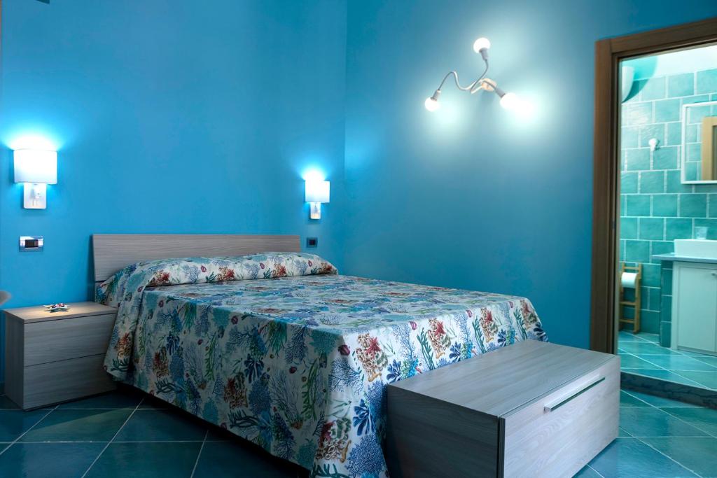 Postel nebo postele na pokoji v ubytování Casina Lambis