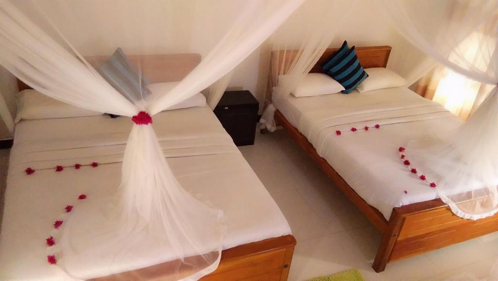 Postel nebo postele na pokoji v ubytování Marvellous Inn