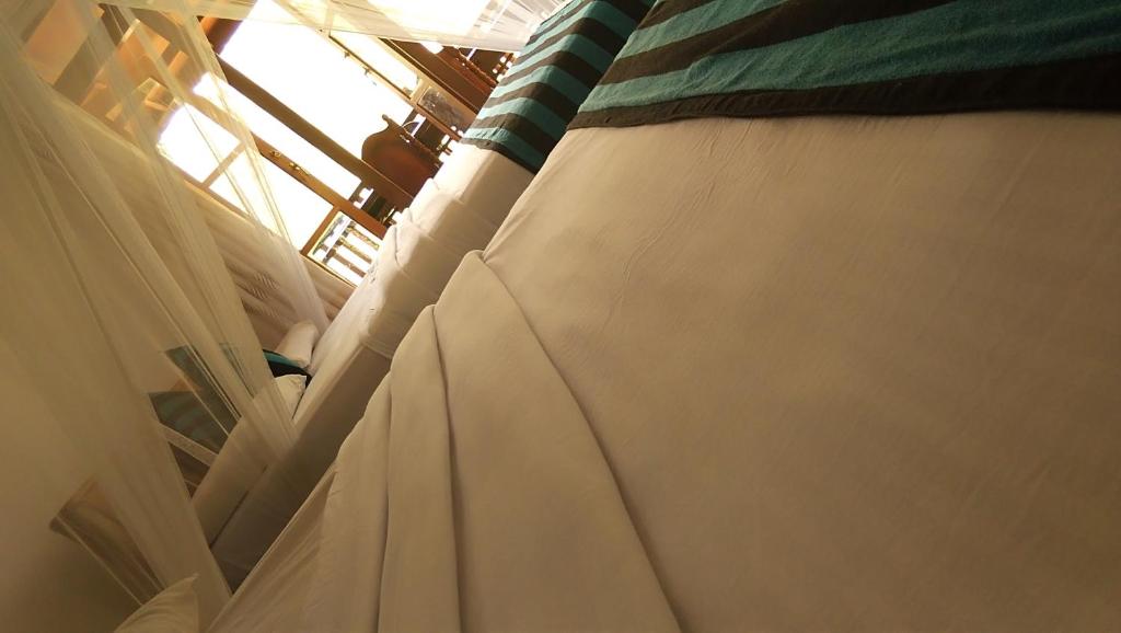 Postel nebo postele na pokoji v ubytování Marvellous Inn