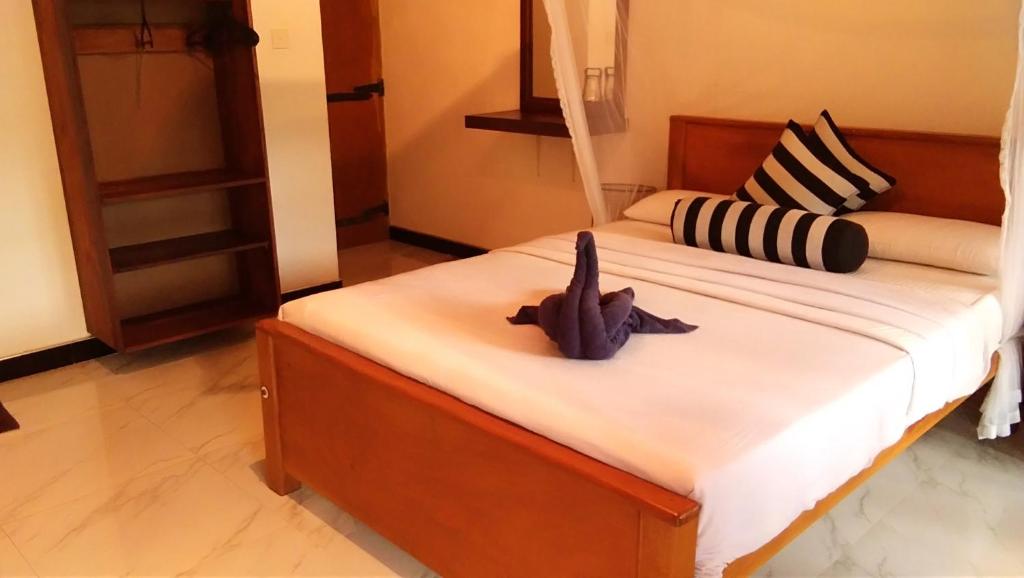 Postel nebo postele na pokoji v ubytování Marvellous Inn