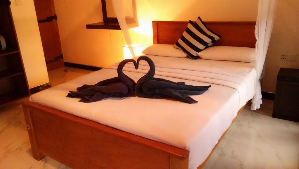 Postel nebo postele na pokoji v ubytování Marvellous Inn