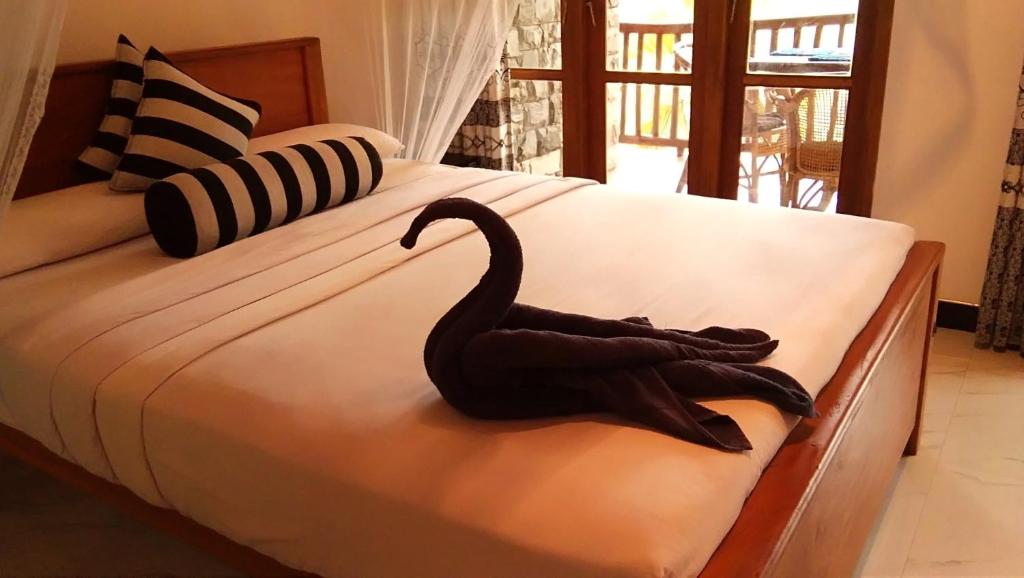 Postel nebo postele na pokoji v ubytování Marvellous Inn