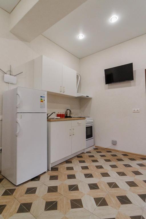 Kuchyň nebo kuchyňský kout v ubytování Apartments na Beregu
