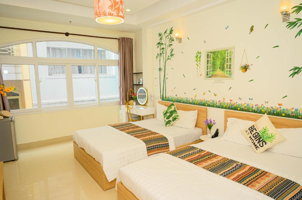 Posteľ alebo postele v izbe v ubytovaní Jasmine Hotel