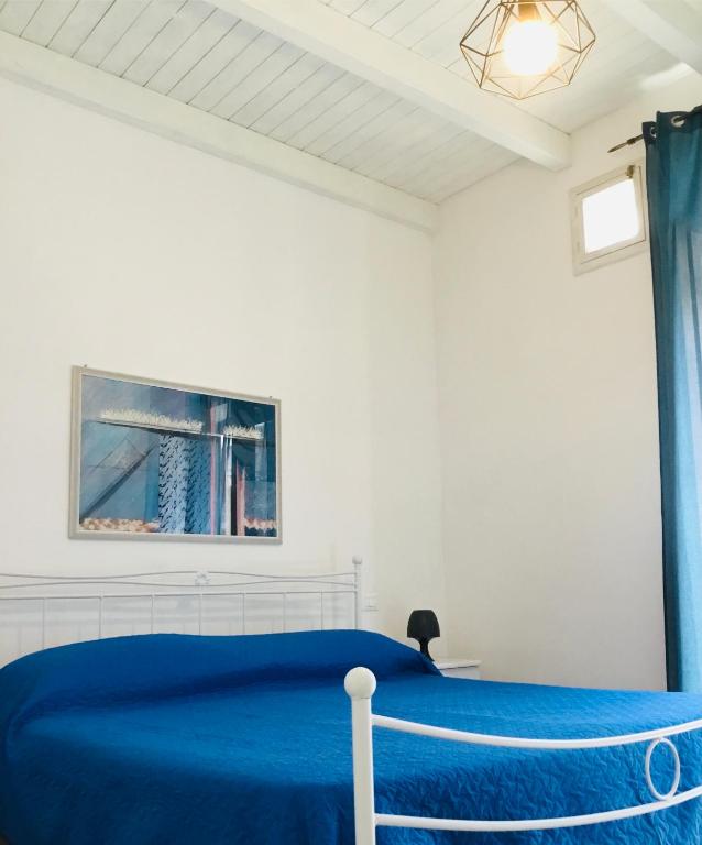 A bed or beds in a room at Camere Simona