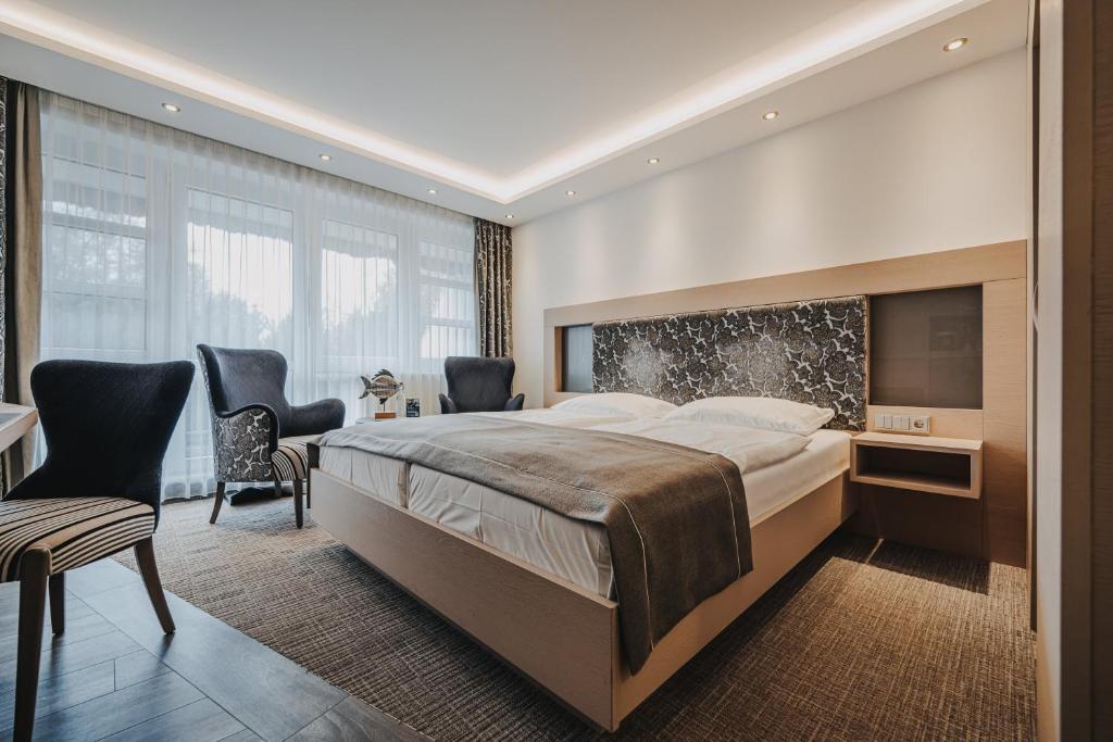 Postel nebo postele na pokoji v ubytování Hotel Graf Bentinck