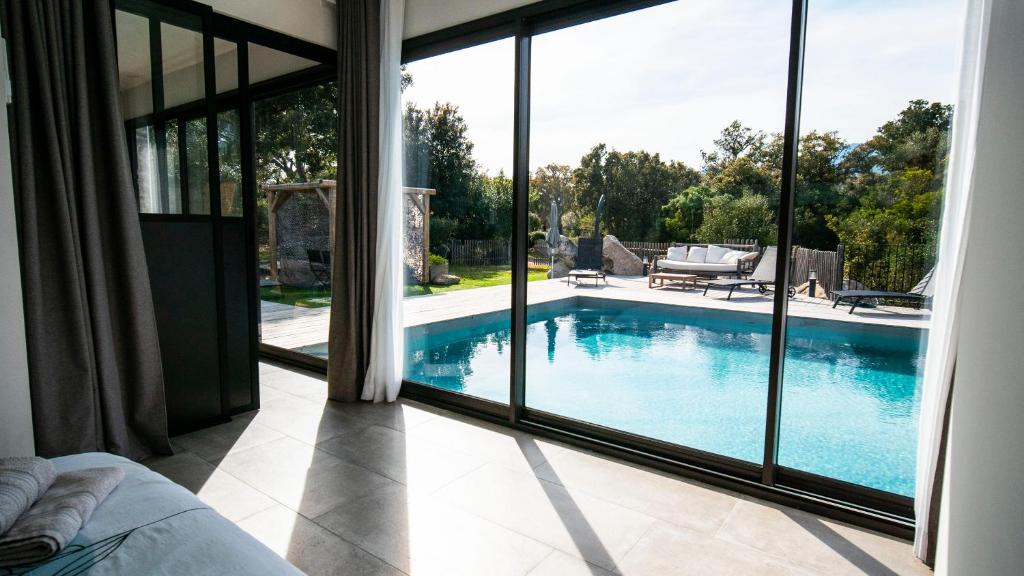 a view of a swimming pool from a house at villa rocca in Sotta