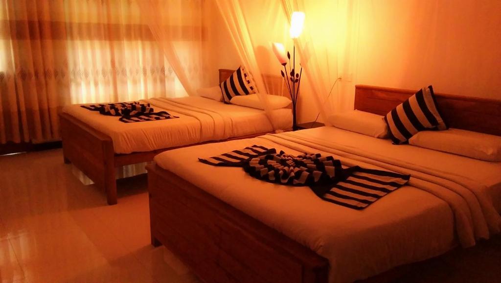 Postel nebo postele na pokoji v ubytování Marvellous Inn