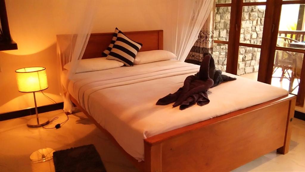 Postel nebo postele na pokoji v ubytování Marvellous Inn