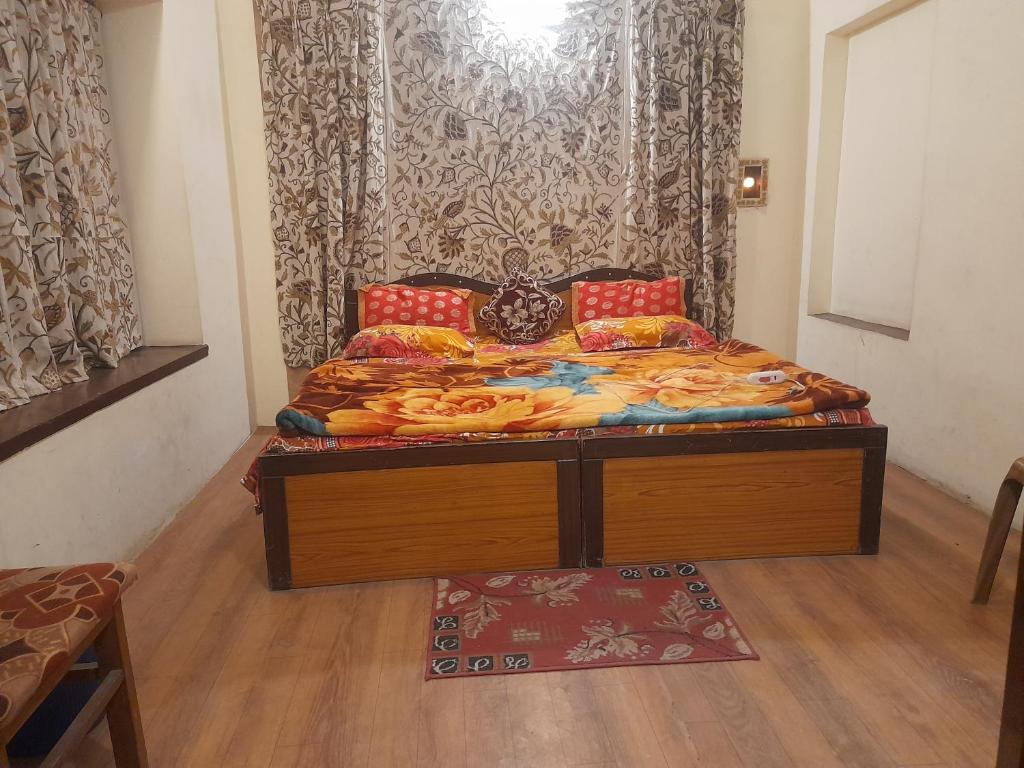 Postel nebo postele na pokoji v ubytování Hotel Jannat