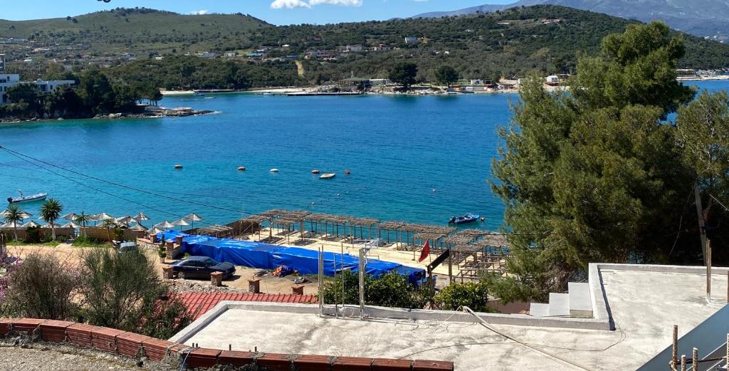 a view of a lake with people swimming in it at Ion Sea View in Ksamil