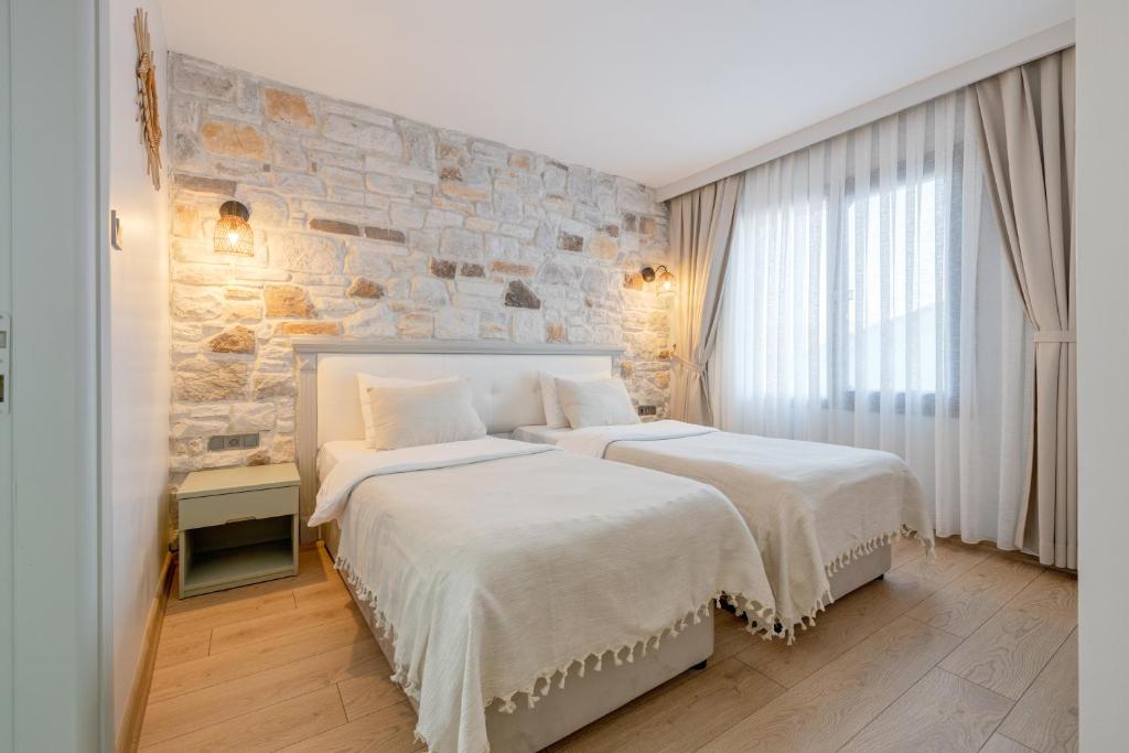 Postel nebo postele na pokoji v ubytování Hanedan Otel Foca Izmir