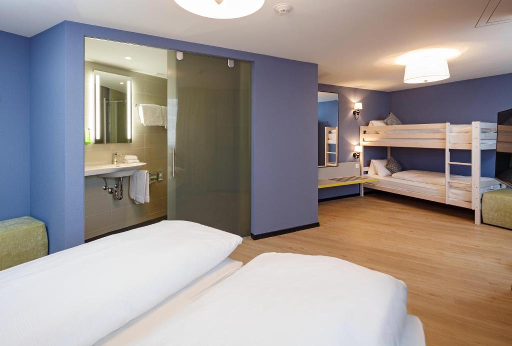 Postel nebo postele na pokoji v ubytování Hotel & Restaurant Chärnsmatt