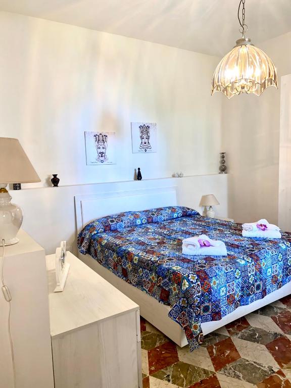 Posteľ alebo postele v izbe v ubytovaní La casa dei bouganville Lo stagnone