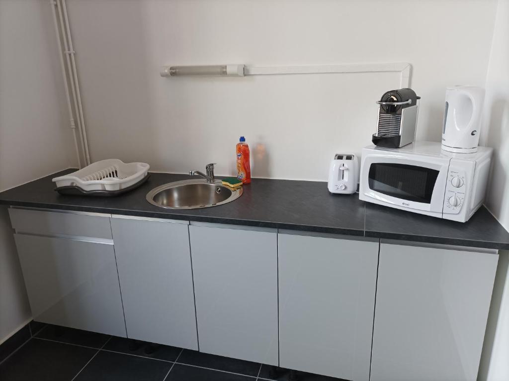 Kuchyňa alebo kuchynka v ubytovaní O'Couvent - Appartement 87m2 - 4 chambres - A511
