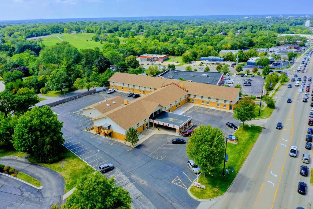 an aerial view of a building with a parking lot at Equality Inn in Rockford