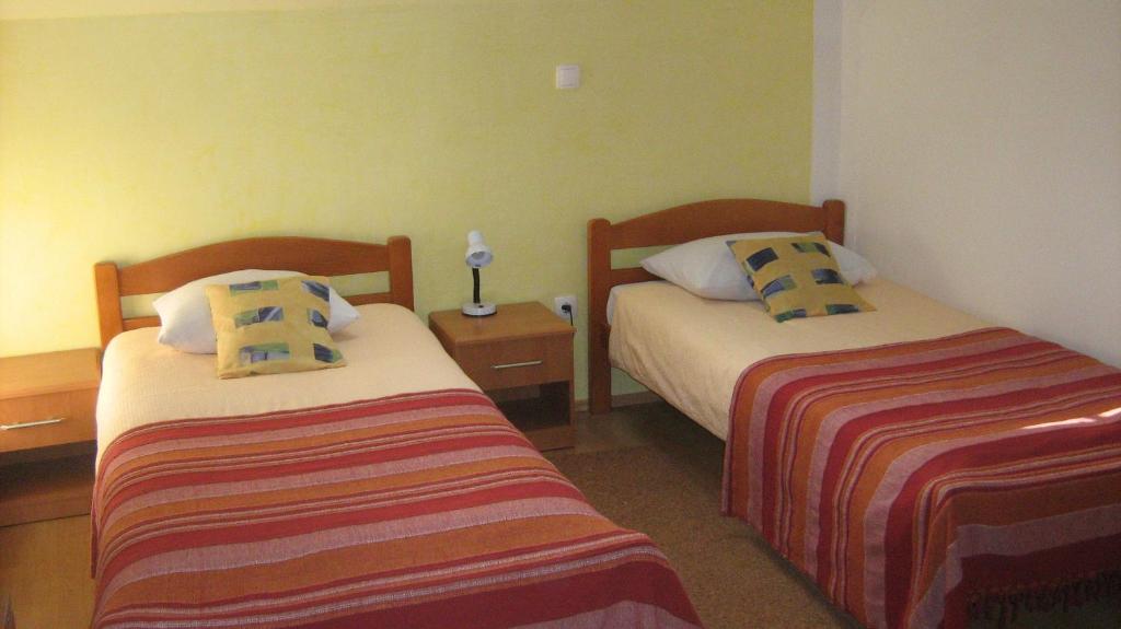 מיטה או מיטות בחדר ב-Farm stay Lackovic