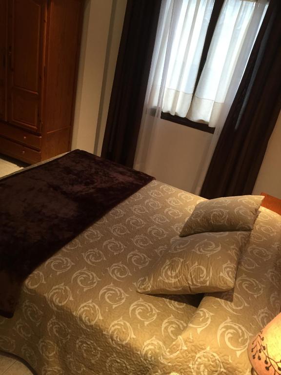 Cama o camas de una habitación en Hostal Alcázar