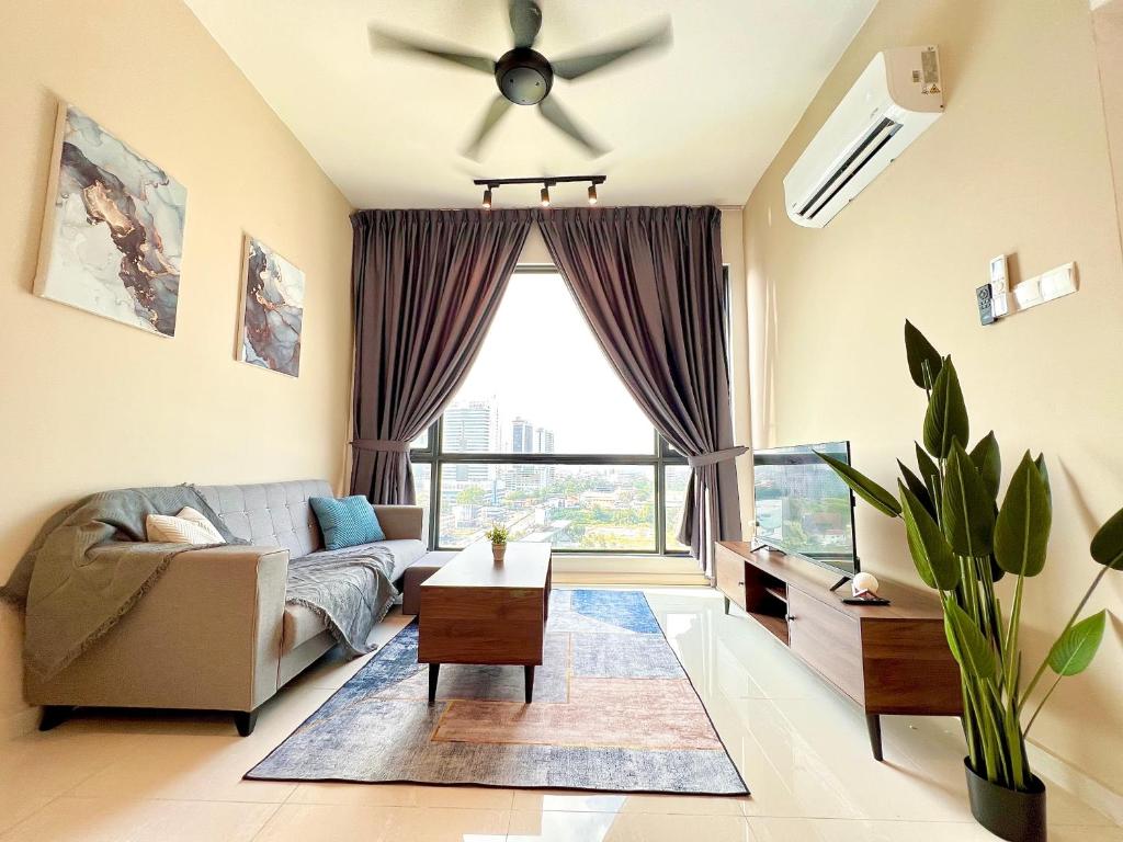 a living room with a couch and a ceiling fan at SKS Pavillion Residence romantic luxury unit JBCC Netflix YouTube in Johor Bahru