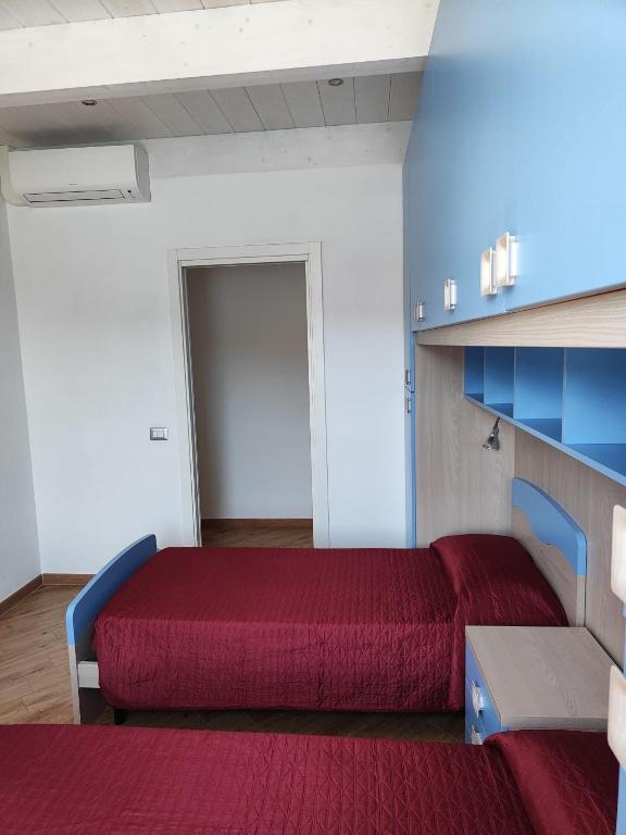 Posteľ alebo postele v izbe v ubytovaní Casa della Nonna casevacanzeargentario