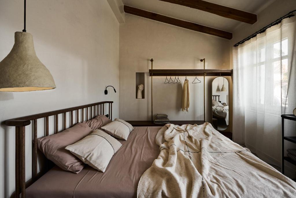 Ένα ή περισσότερα κρεβάτια σε δωμάτιο στο OCRE the art of living