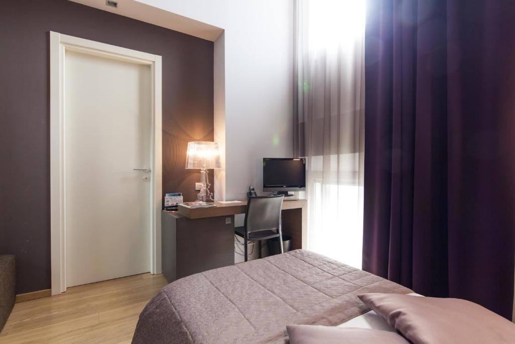 TV a/nebo společenská místnost v ubytování Hotel Michelangelo