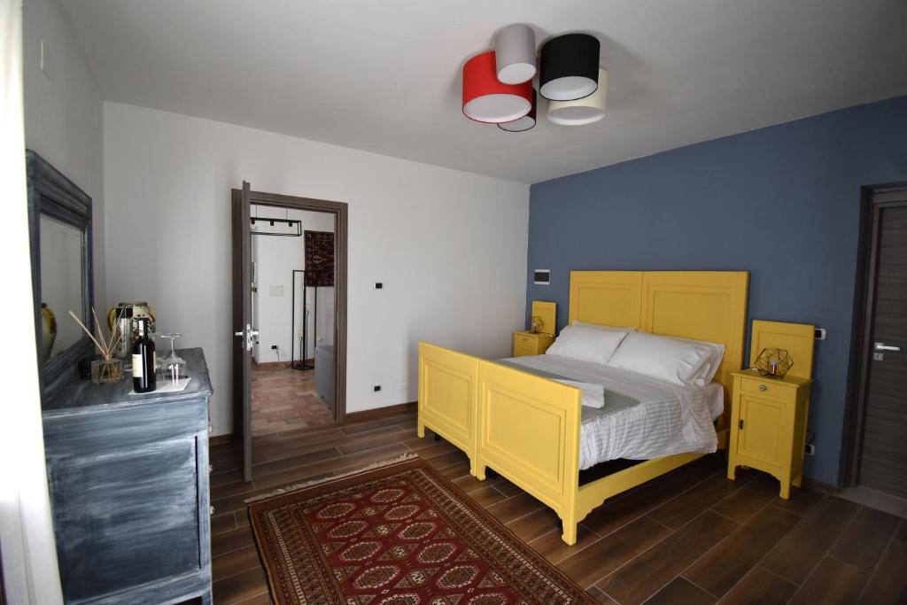 Postel nebo postele na pokoji v ubytování Cascina Tre Botti