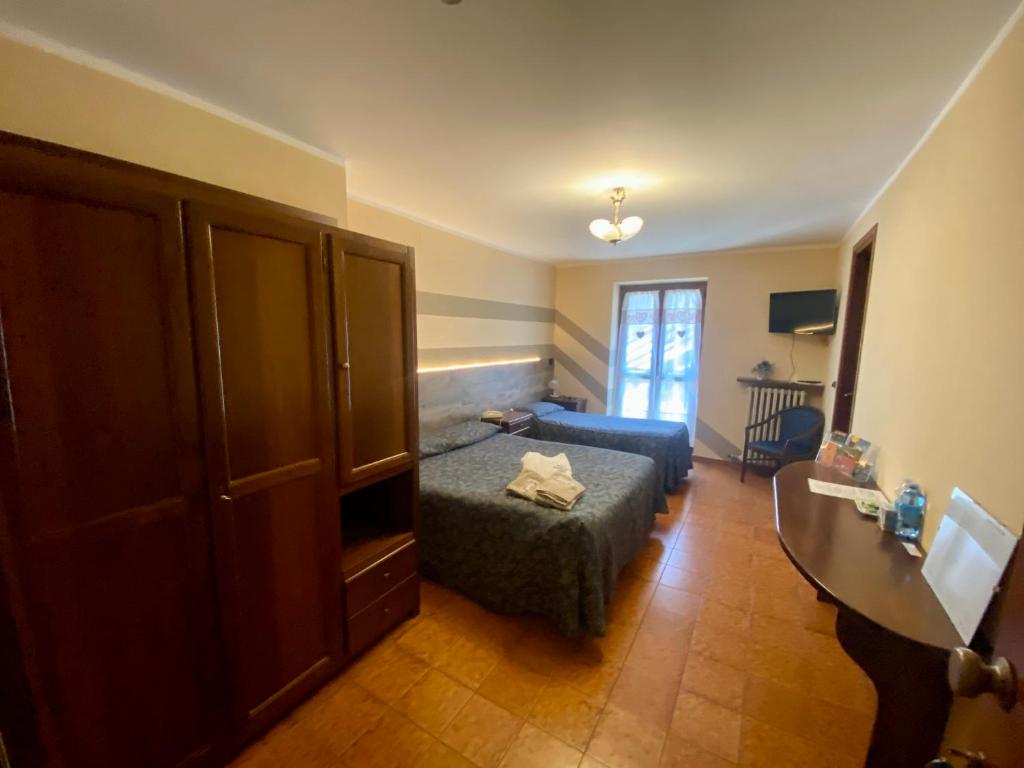 Postel nebo postele na pokoji v ubytování Hotel Ristorante Ligure