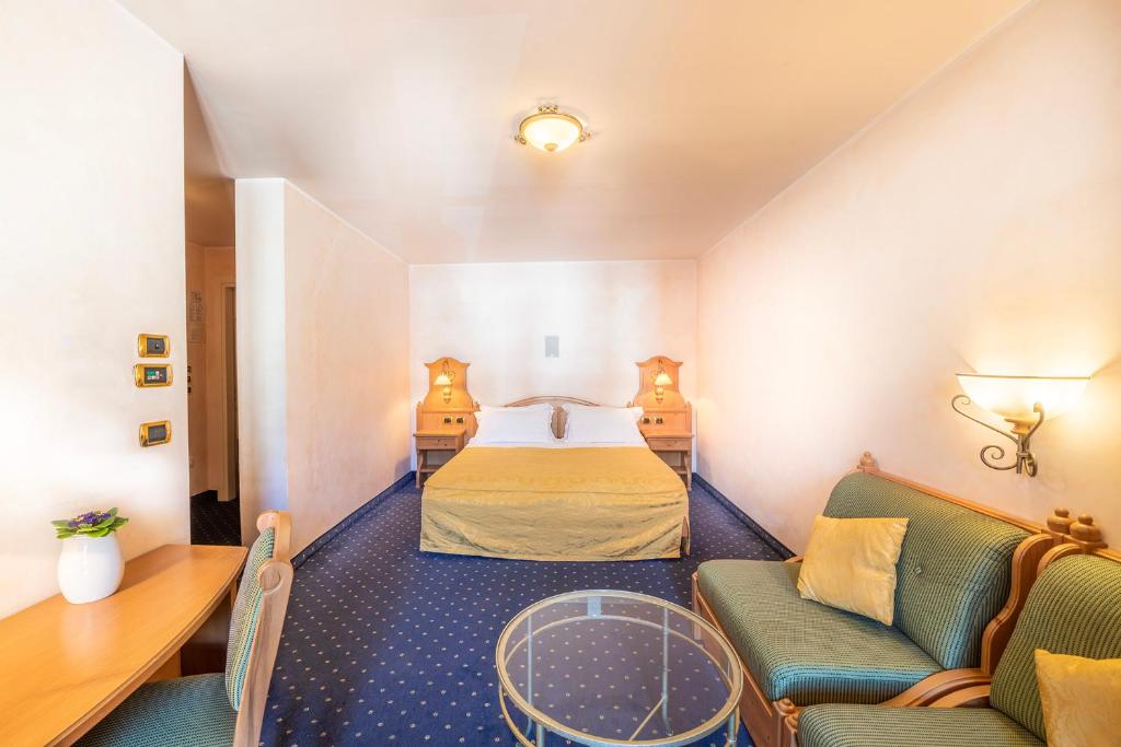 Postel nebo postele na pokoji v ubytování Hotel Relais Orsingher