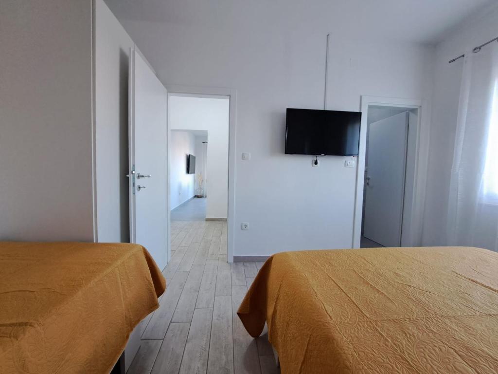 Postel nebo postele na pokoji v ubytování Apartments Benic