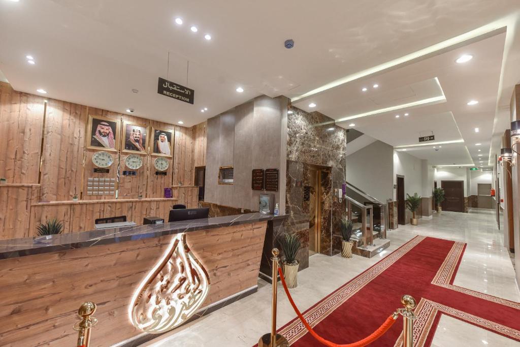 a lobby of a building with a red carpet at شقق الهدوء Alhudu Apartments in Riyadh