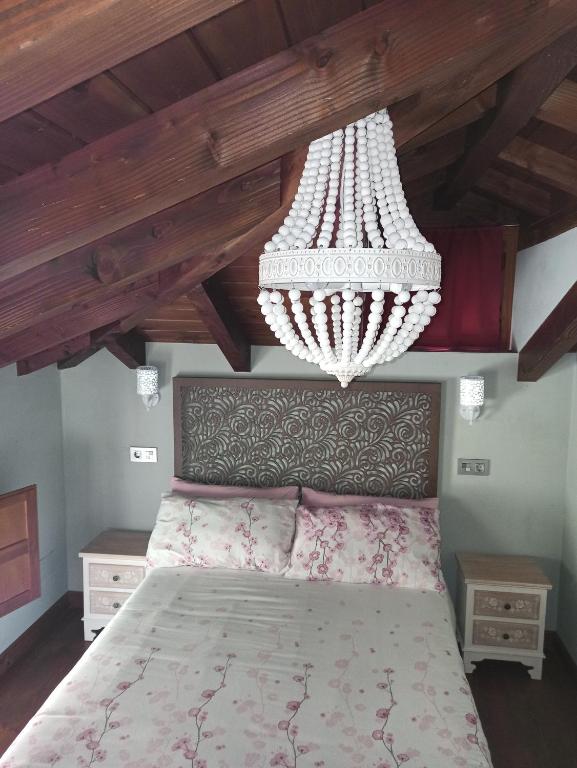 Postel nebo postele na pokoji v ubytování Aromas de Coraín
