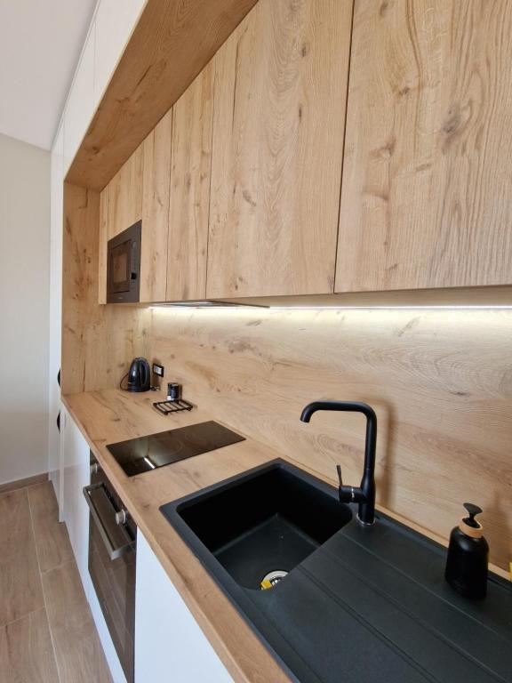 Kuchyň nebo kuchyňský kout v ubytování Anchor Apartments