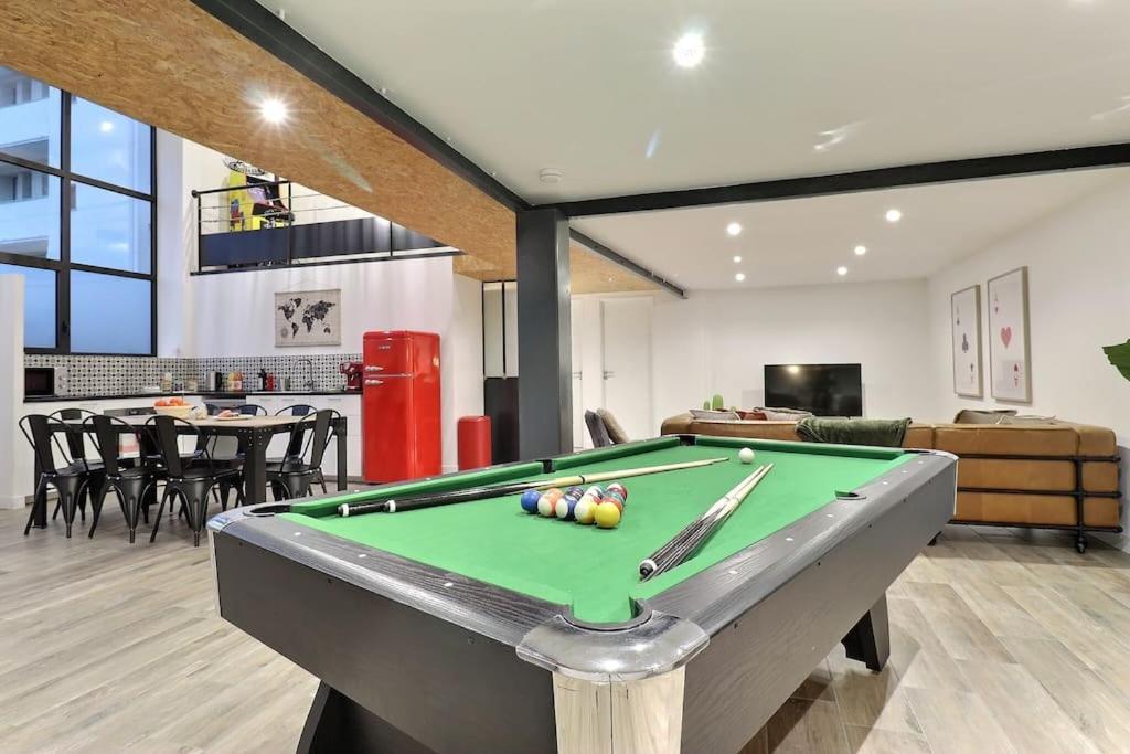 a pool table in the middle of a living room at LOFT Valence - Centre in Valence