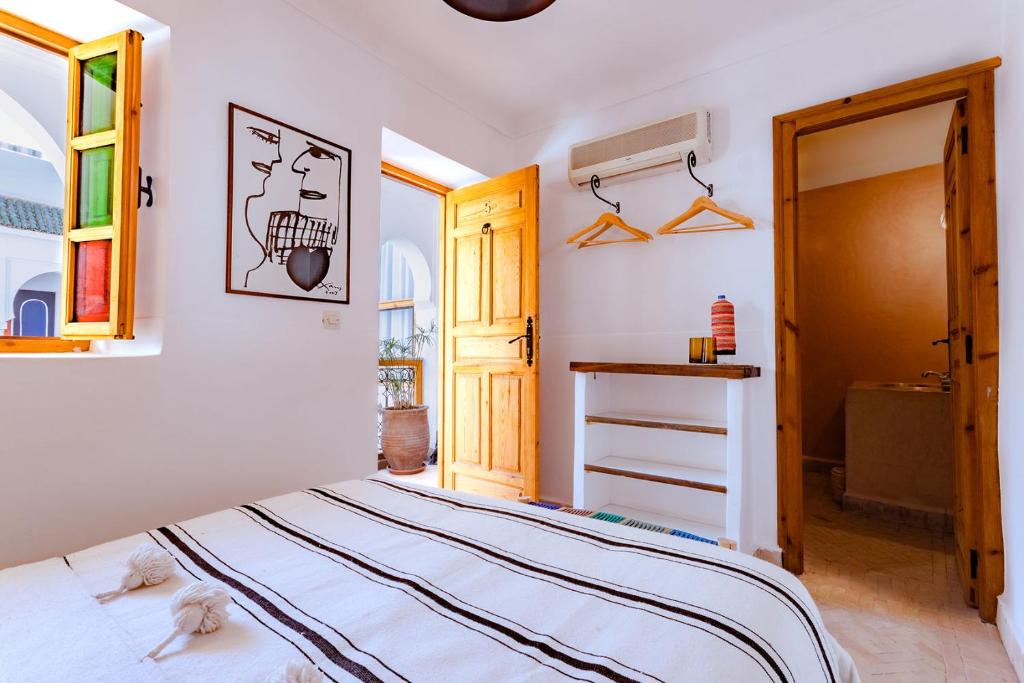Postel nebo postele na pokoji v ubytování SABOR SAFRA