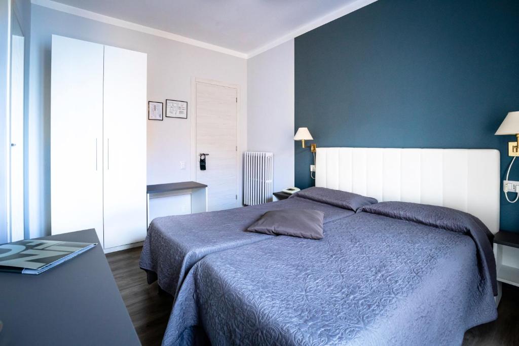 Postel nebo postele na pokoji v ubytování Hotel Romagna