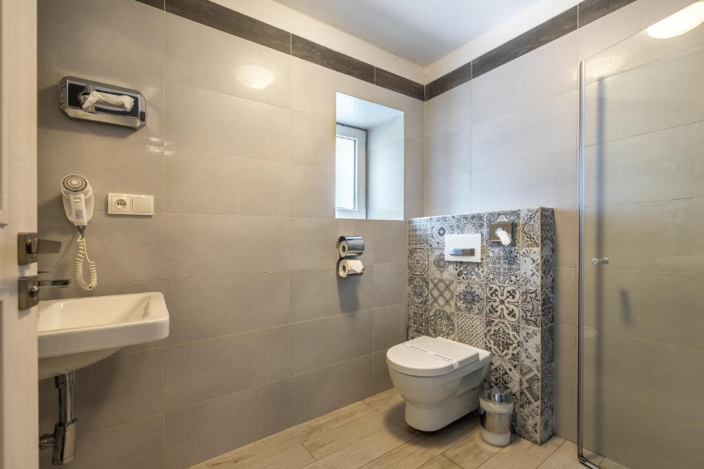 a bathroom with a toilet and a sink at Apartmány U Pavla in Český Krumlov