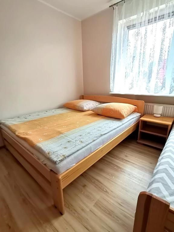 Postel nebo postele na pokoji v ubytování Villa Joanna