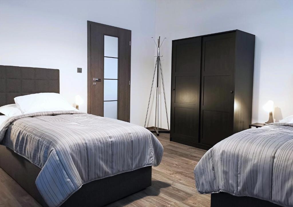 Postel nebo postele na pokoji v ubytování Apartmánový dům Sklípek