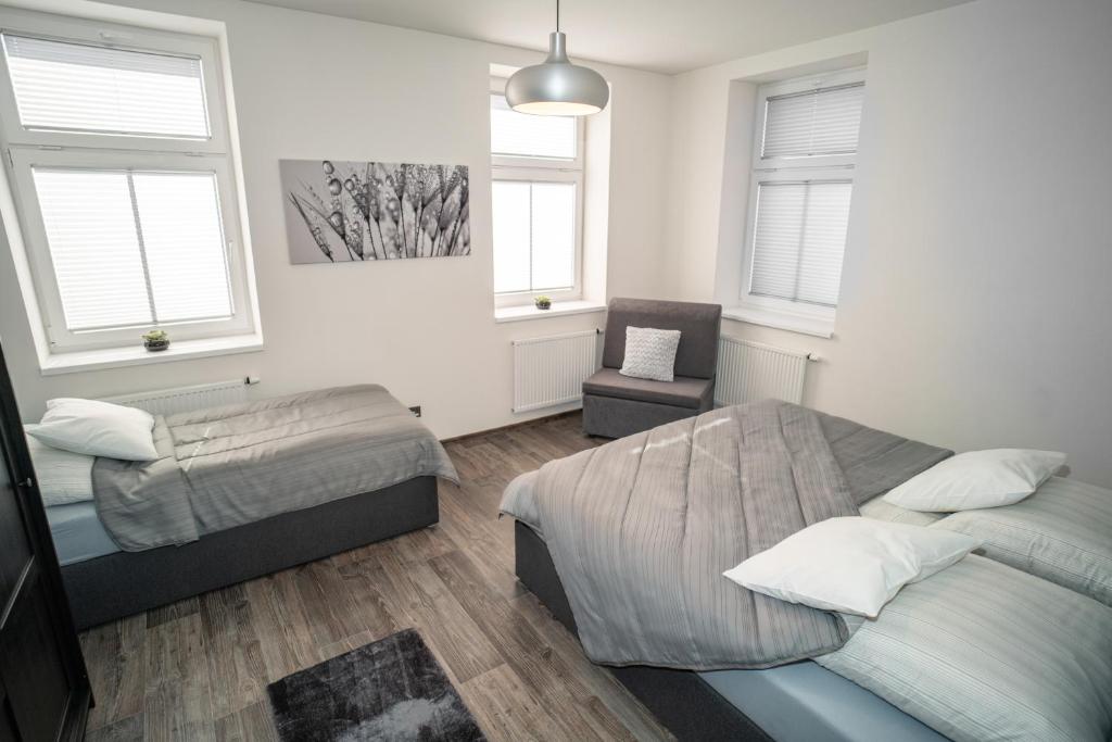 Postel nebo postele na pokoji v ubytování Apartmánový dům Sklípek
