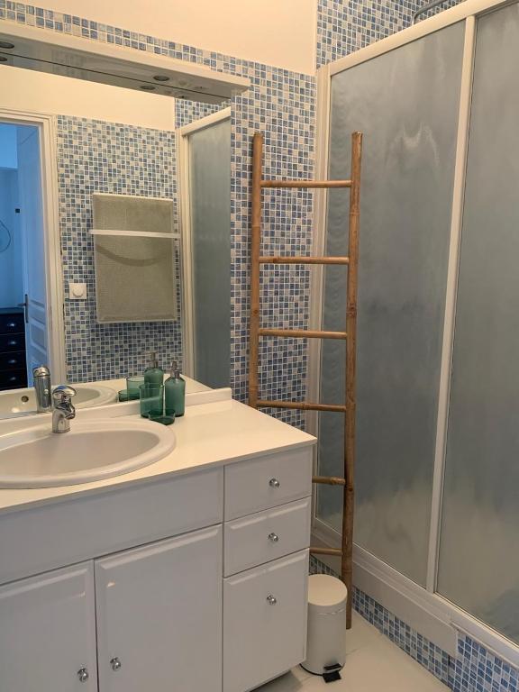 a bathroom with a sink and a shower at Maison Angouleme, France in Angoulême