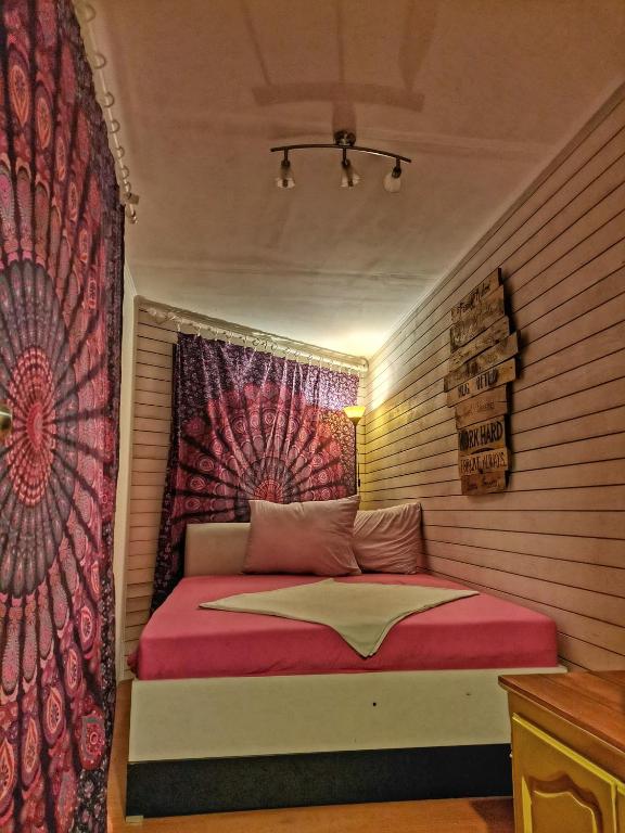 a small bedroom with a bed in a room at FREEDOM 2 in Gornji Štoj