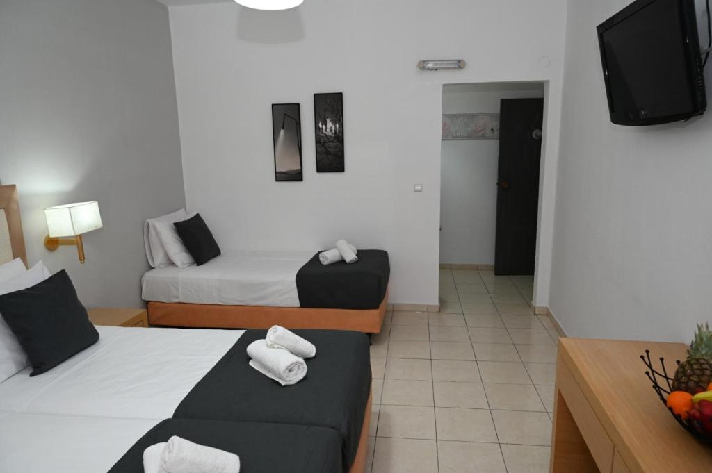 Postel nebo postele na pokoji v ubytování ANGELA STUDIOS