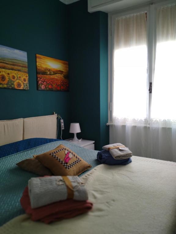 Ένα ή περισσότερα κρεβάτια σε δωμάτιο στο Trilocale Cecilia's Studio